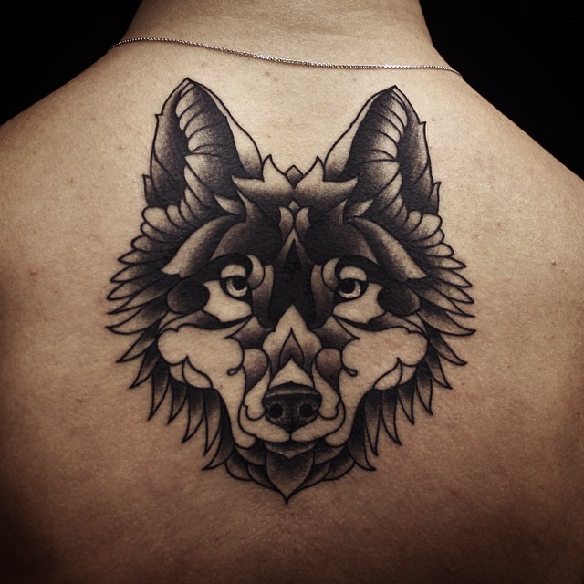 Lower Neck Wolf tattoo