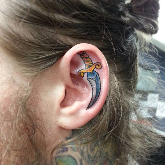 Dagger Ear Tattoo by @kcalverttattoos