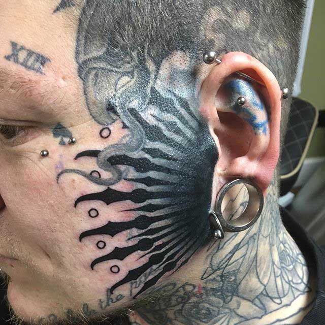 Close to The Ear Face Tattoo by Danny Fogg