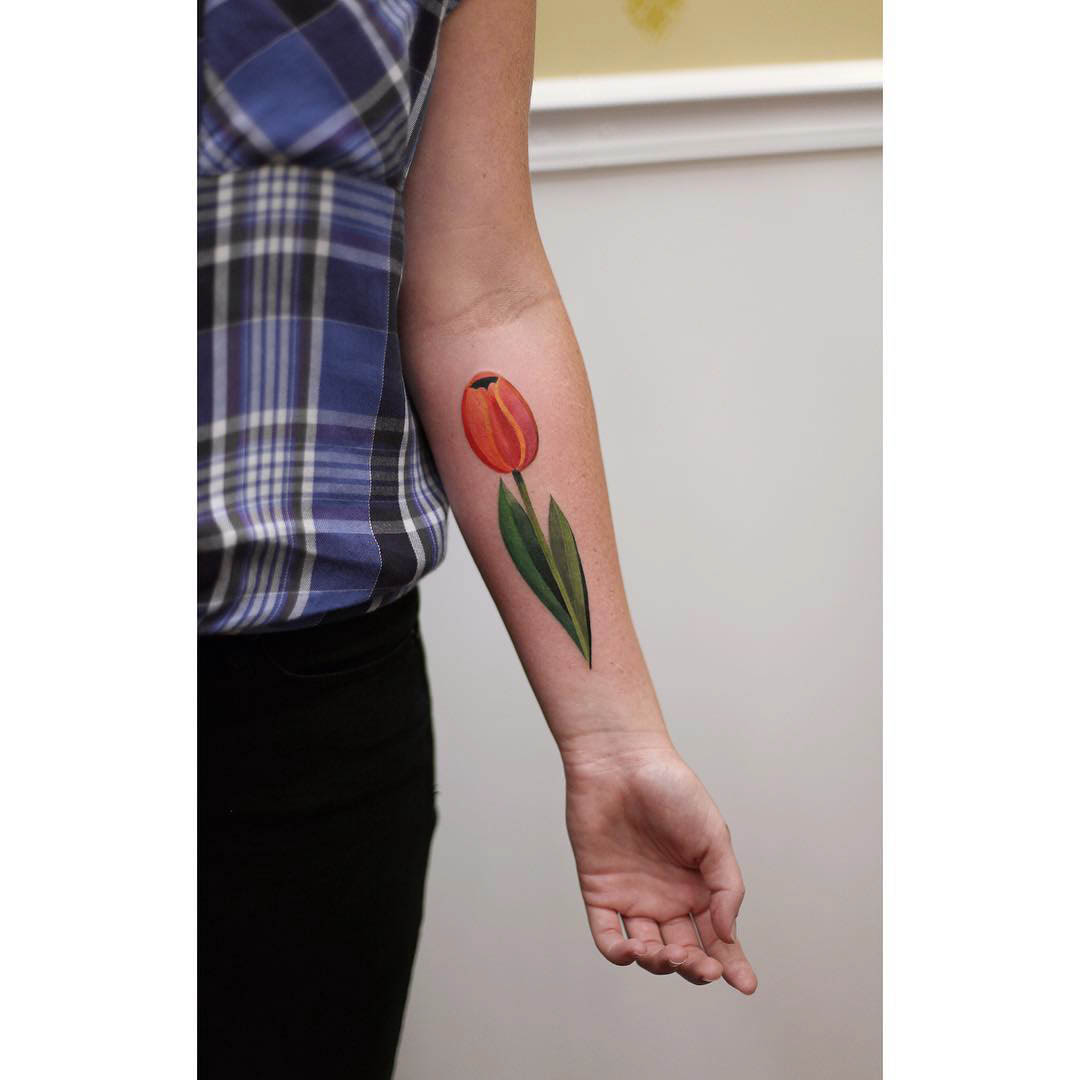 forearm tattoo of a tulip