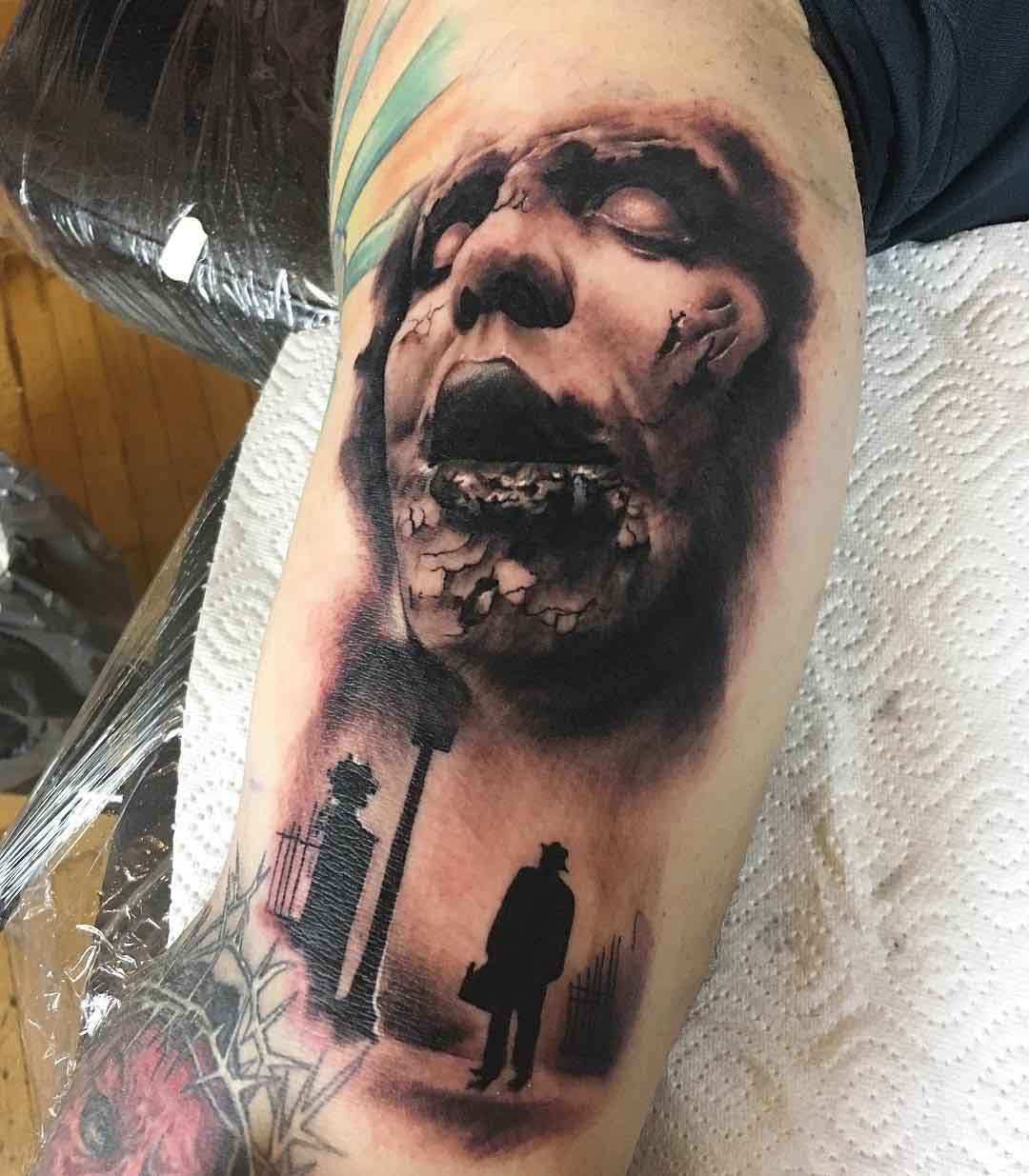 back bicep horror tattoo