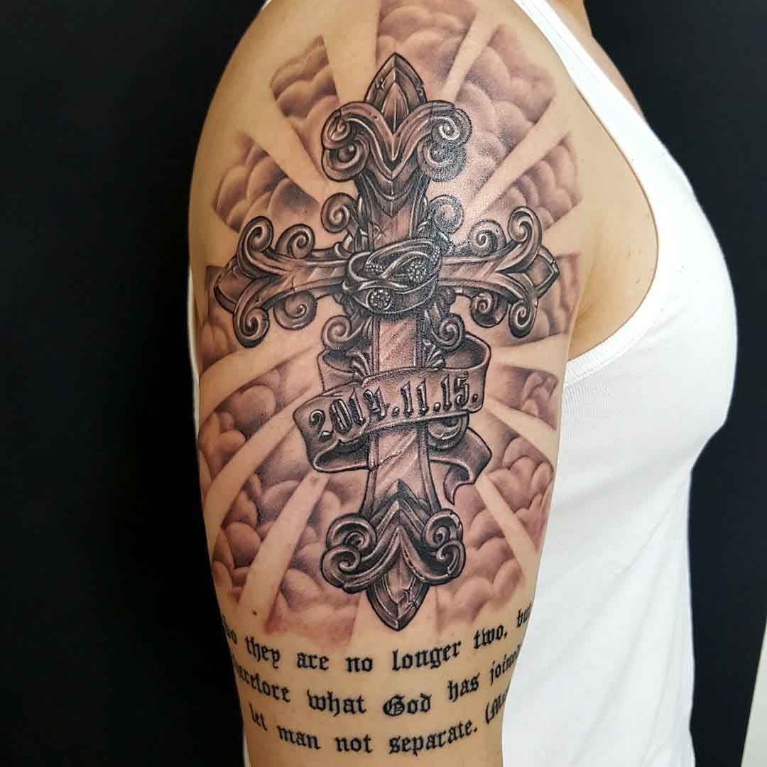 shoulder crucifix tattoo