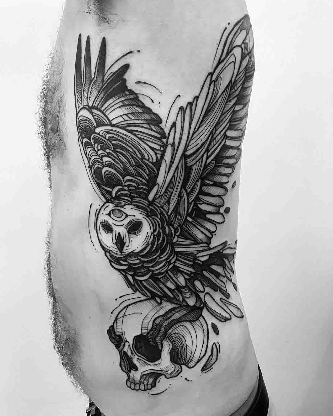 torso side tattoo owl and skull