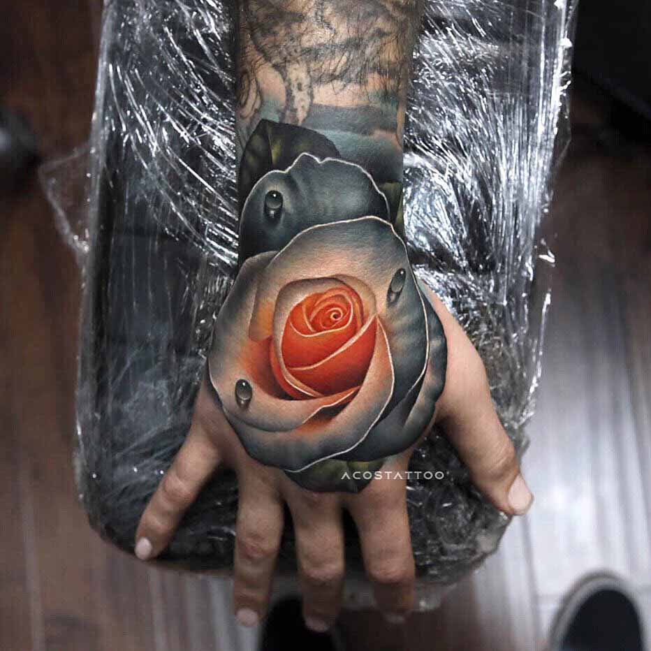 grey soft rose tattoo on hand