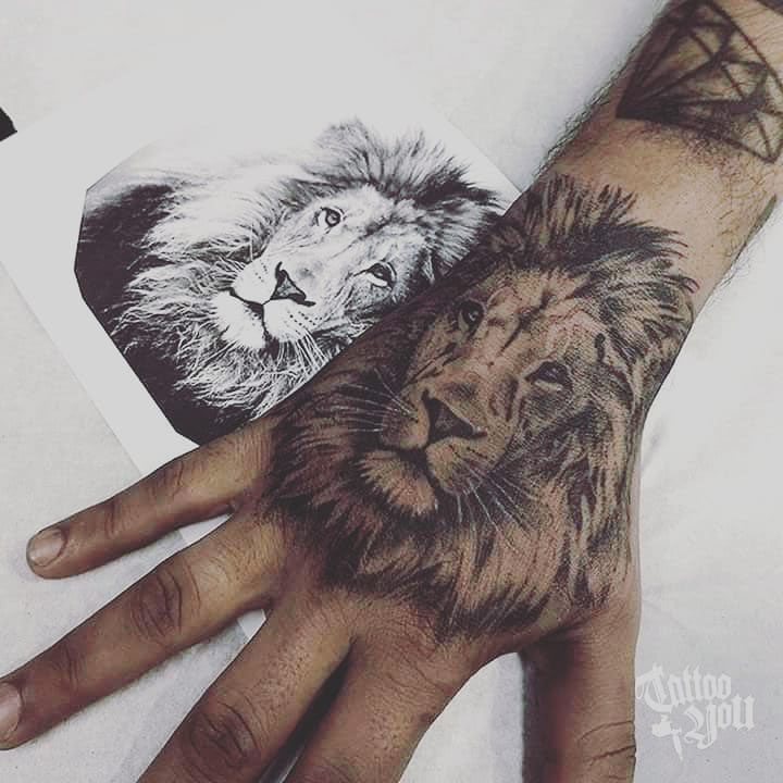 hand tattoo lion
