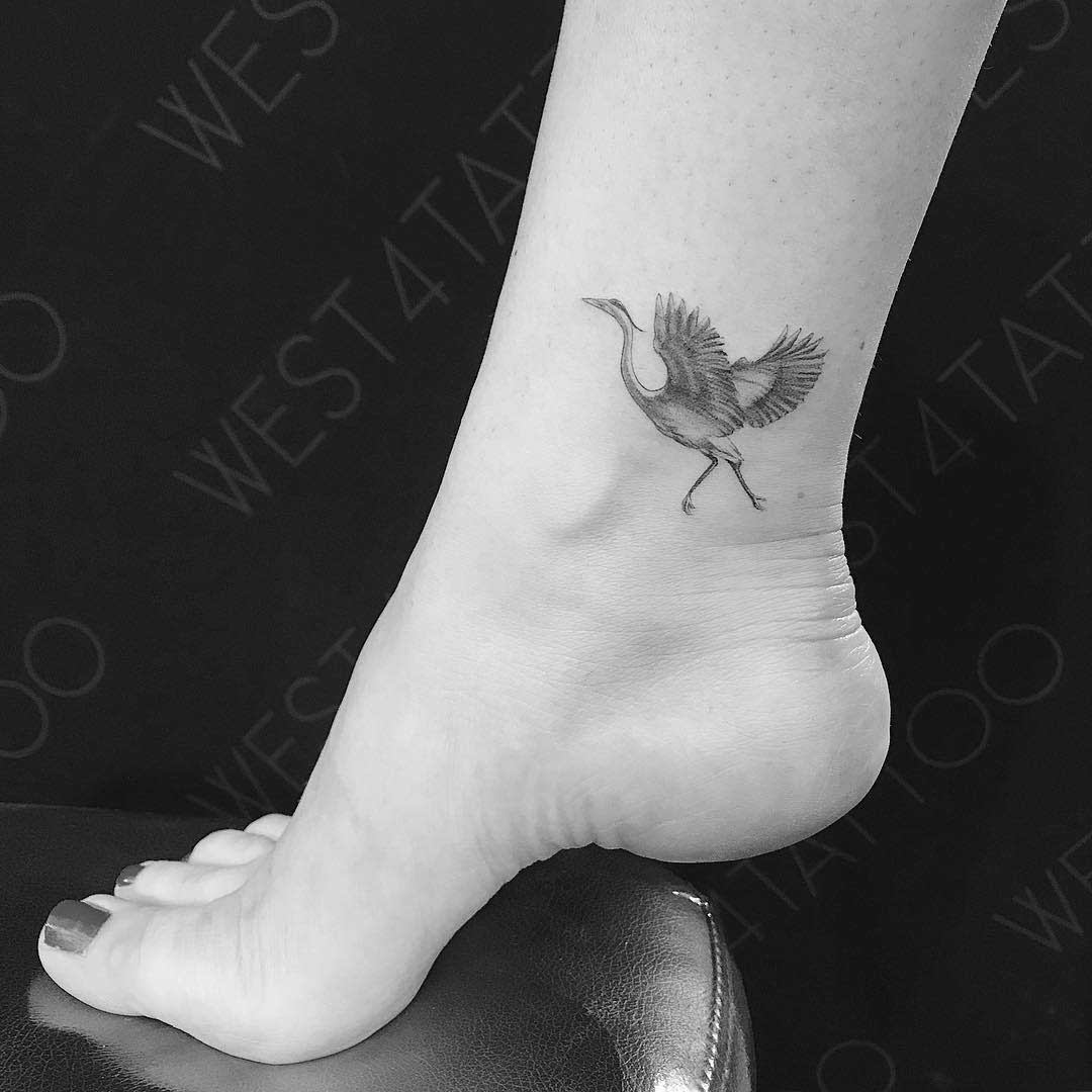 ankle tattoo crane