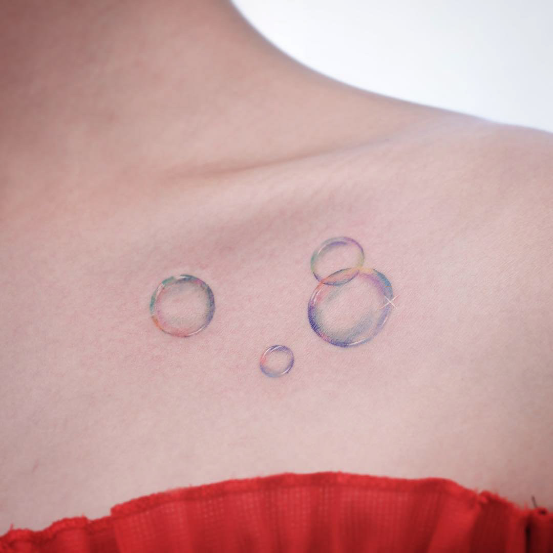 collar bone bubbles tattoo